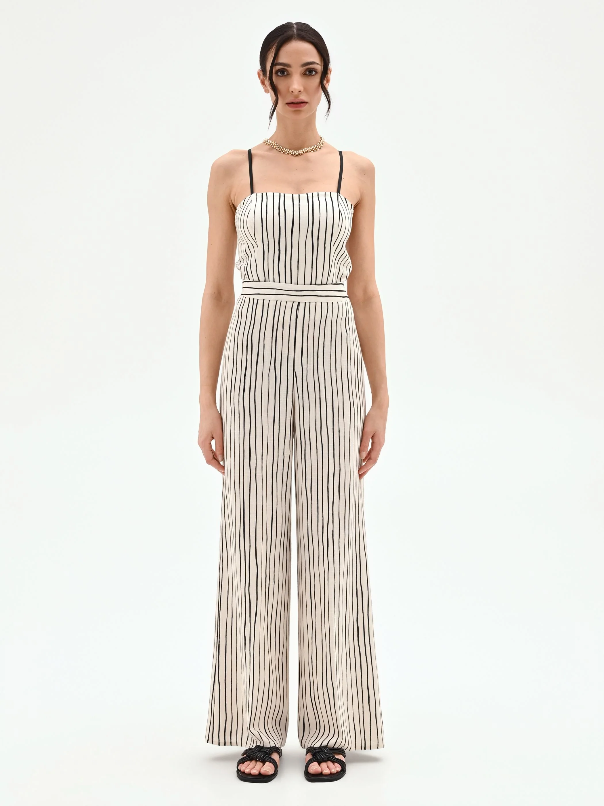 Pantalone in lino panna a palazzo con fantasia a righe